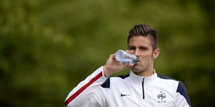 French National football team's foward Olivier Giroud drinks water before a training session, in Clairefontaine-en-Yvelines, outside Paris, on May 25, 2014, during the team's preparation for the upcoming FIFA 2014 World Cup. AFP PHOTO / FRANCK FIFE (Photo credit should read FRANCK FIFE/AFP/Getty Images)